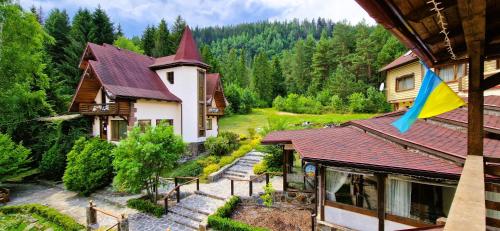 an aerial view of a house with a flag at Complex Hyzhky in Yaremche