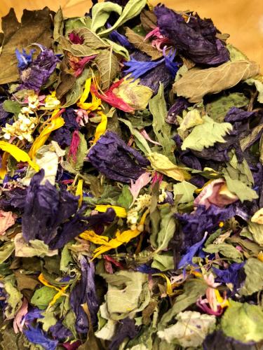 a pile of green and purple leafy materials at Chalet Elisabeth dolomites alpin & charme in Selva di Val Gardena