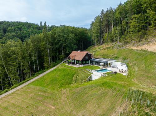 an aerial view of a house and a rv on a hill at eichberg living in Leutschach