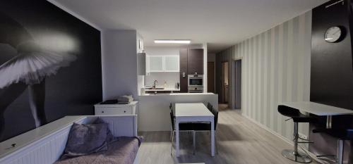 a living room with a couch and a table at Apartments Apart 59 in Gdańsk