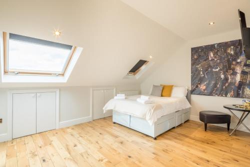 a bedroom with a bed and a window at Tulse Hill Luxury Cosy Rooms in London