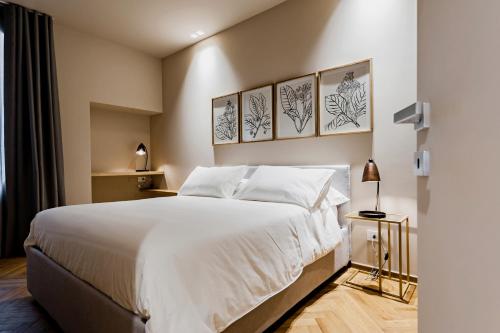 Postel nebo postele na pokoji v ubytování Ferrini Home - Etnea Heritage