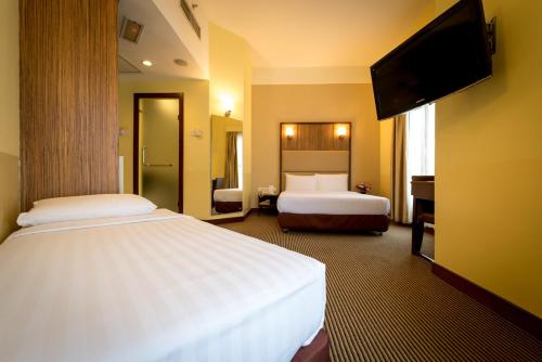 Ένα ή περισσότερα κρεβάτια σε δωμάτιο στο Hotel Sentral KL @ KL Sentral Station