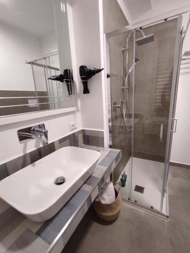 a bathroom with a sink and a shower at DonPè in Agrigento