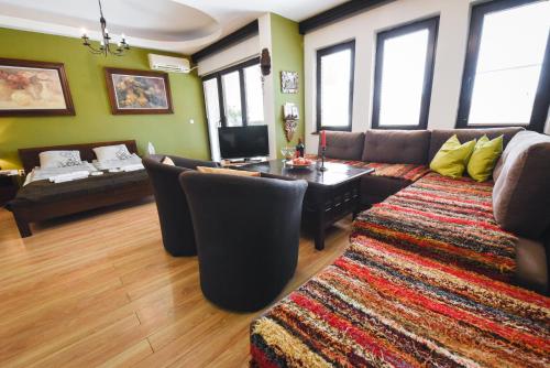 a living room with a couch and a table at Jovanovic Guest House in Ohrid