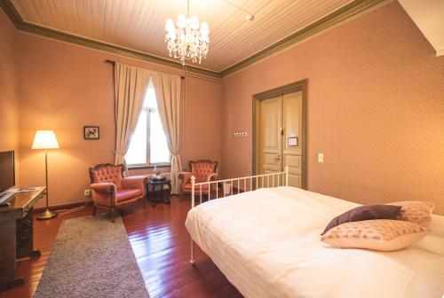 Postel nebo postele na pokoji v ubytování Cafe-Restaurant & Hotel Saima