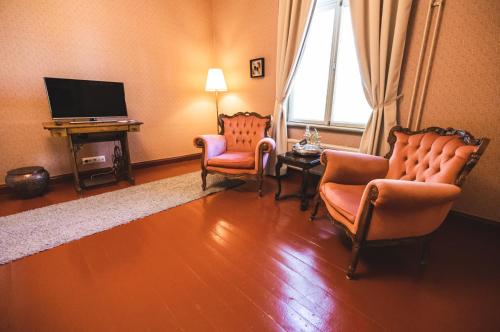 TV a/nebo společenská místnost v ubytování Cafe-Restaurant & Hotel Saima