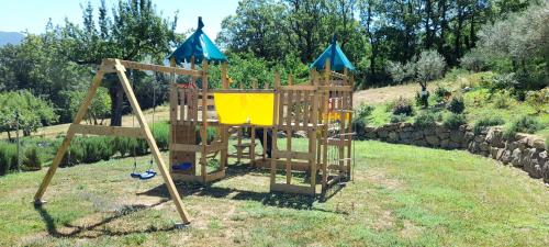a playground in a yard with a slide at Masseria boutique b&b in Montella