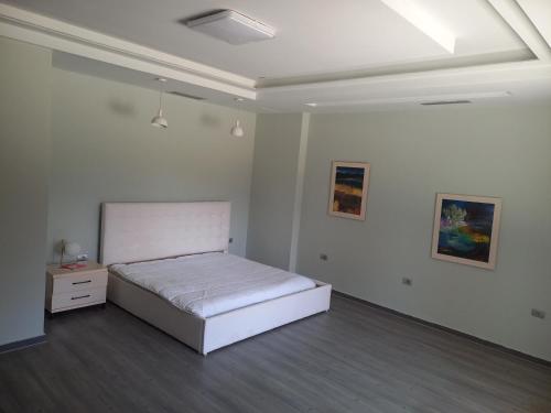 a bedroom with a bed and a dresser in it at Holiday Home for Tourist in Golem