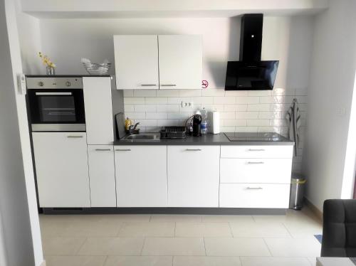 Kuchyň nebo kuchyňský kout v ubytování Apartment Jacky