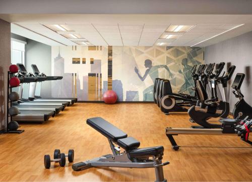a gym with several treadmills and exercise bikes at Hyatt House LA - University Medical Center in Los Angeles
