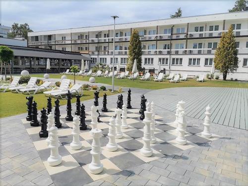 a giant chessboard in front of a large building at San Medical Spa in Kołobrzeg