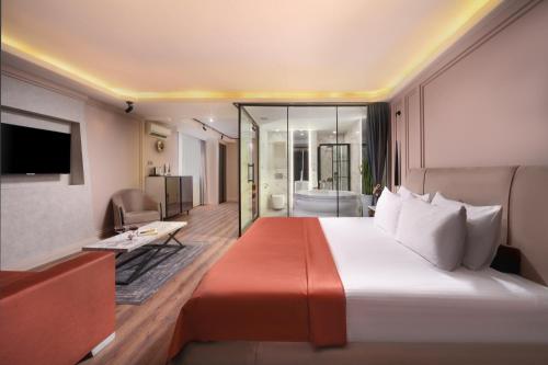 a hotel room with a large bed and a bathroom at Harbiye Residence in Istanbul