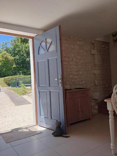 a teddy bear sitting in front of a door at Chez Goret Gites - Gite Skippy Couples only in Courgeac