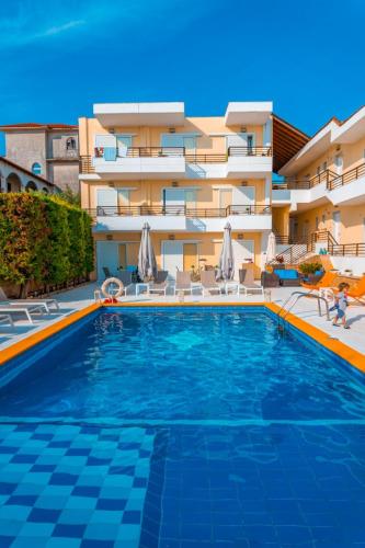 a large swimming pool in front of a building at Maya Bay in Kallithea Halkidikis