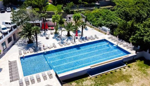 an overhead view of a swimming pool with chairs and trees at The Sign Degirmen Hotel&Spa Wellness in Istanbul