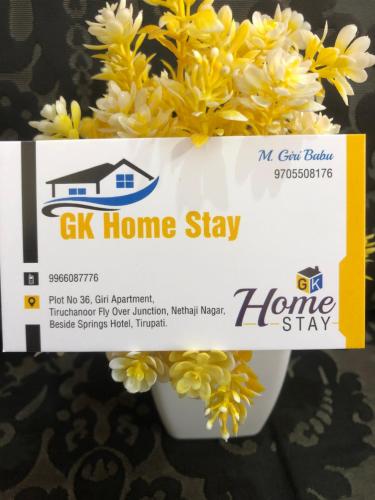 a box of gas home stay next to flowers at G k Homestay in Tirupati