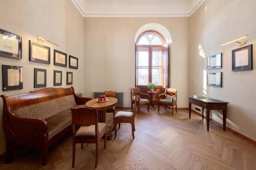 a living room with a couch and a table at Schloss Fellin Boutique Hotel and Spa in Viljandi