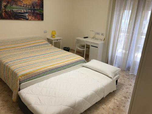 Posteľ alebo postele v izbe v ubytovaní B&b Il Bacio
