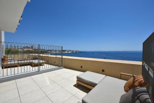 a balcony with a view of the ocean at Santateresa in Bonifacio
