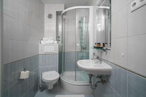 a bathroom with a toilet and a sink at B&B Sidro in Vodice