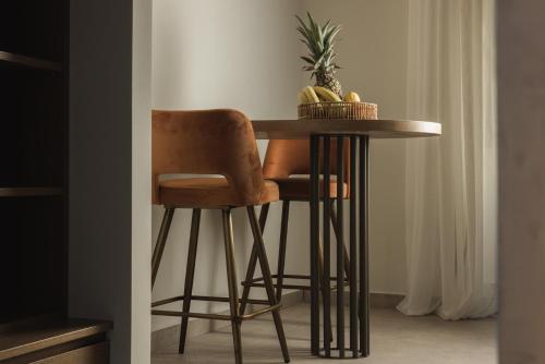 a bar stool with a table in a room at Panorama Inn in Lithakia