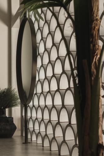 a mirror on a stand in front of a wall at Panorama Inn in Lithakia