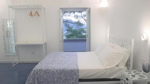 En eller flere senge i et værelse på Villa Enrica