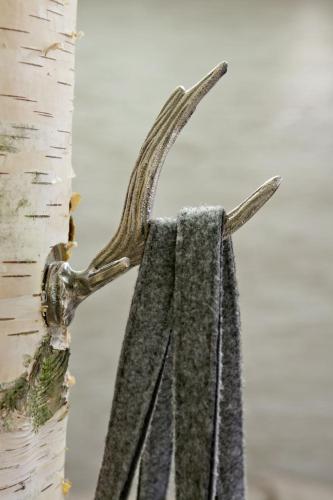 a towel hanging on the side of a tree at Verwöhn-Wellnesshotel Walserhof in Hirschegg