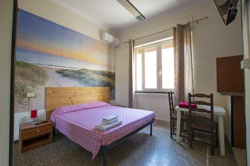 Postel nebo postele na pokoji v ubytování Les Suites Corso Roma