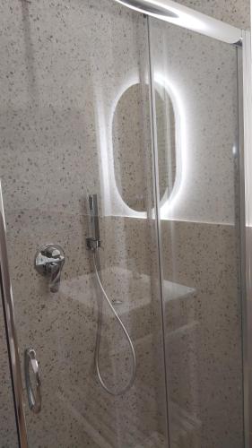 a shower with a glass door in a bathroom at Piccolo paradiso suite in pieno centro Castel di Sangro in Castel di Sangro