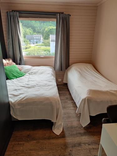 Postel nebo postele na pokoji v ubytování Markveien10 - Koselig og sentrumsnært hus på Grim, Kristiansand