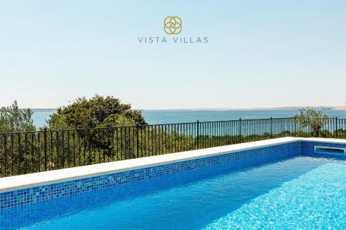 a swimming pool in a villa with a view at Vista Villas - Sunny Pleasure Apartment Villa W in Ražanac