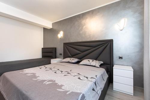 a bedroom with a large bed in a room at Villa Nina Baška in Baška