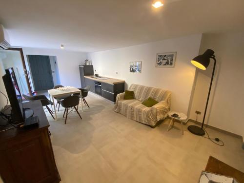 a living room with a couch and a table at Casa Teresa in Porto Pino