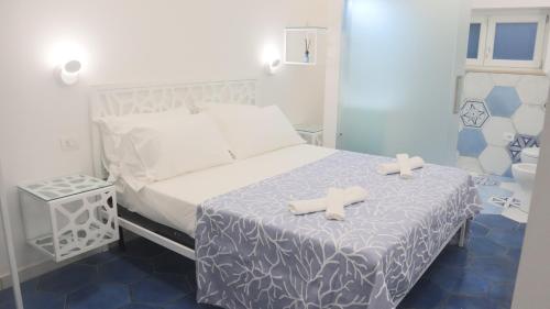 En eller flere senge i et værelse på Villa Enrica