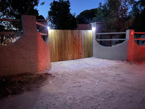 a backyard with a fence and a skateboard ramp at Casa Teresa in Porto Pino
