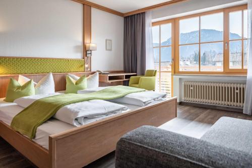 Postelja oz. postelje v sobi nastanitve Hotel AlpenSonne Ruhpolding