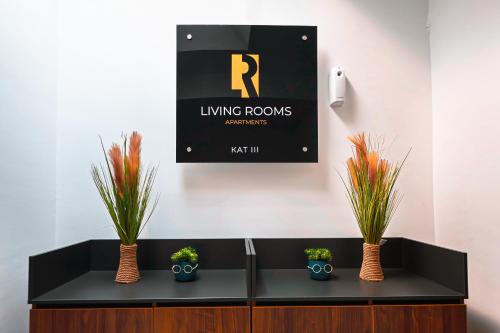 a black counter with potted plants on top of it at Living Rooms in Skopje