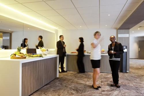 a group of people standing in an office at Mercure Rennes Centre Gare in Rennes