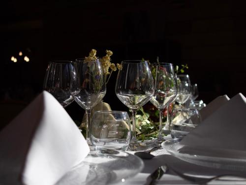 a group of wine glasses sitting on a table at Tropic Hôtel in Rivesaltes
