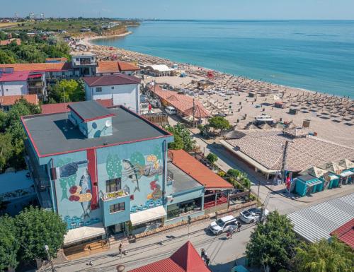 an aerial view of a town with a beach at La Frontiera in Vama Veche