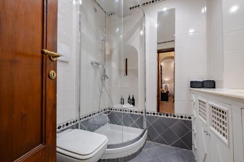 a bathroom with a tub and a toilet and a sink at Roman Forum Apartment - The Heart of Rome in Rome