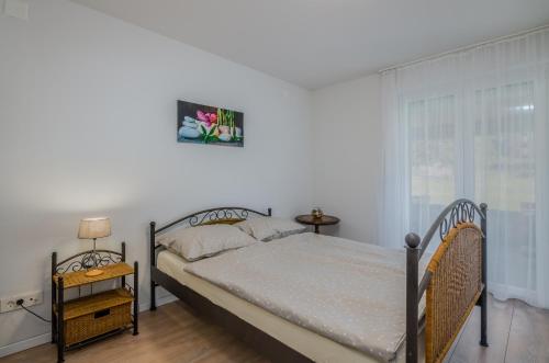 Postel nebo postele na pokoji v ubytování Apartment Tulipan