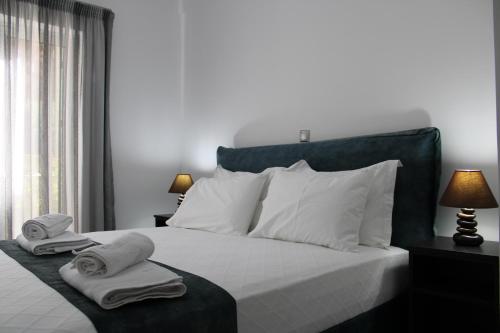 Кровать или кровати в номере Drebos Apartments