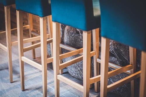 a couple of woodenools sitting under a table at Les Mazots des Fées in Morzine