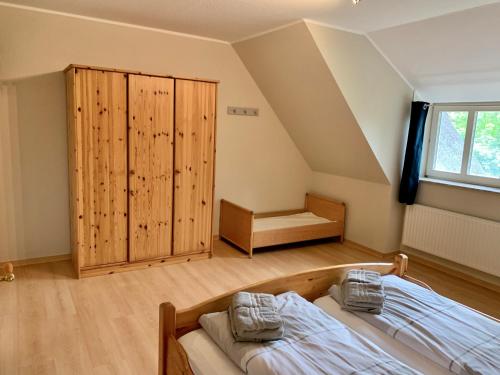 Postel nebo postele na pokoji v ubytování Ferienwohnung 2 im Böhler Haubarg