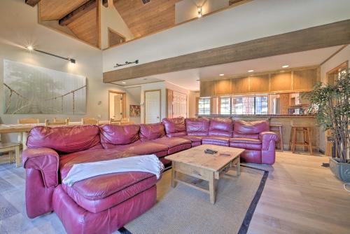 a living room with a purple couch and a table at Wraparound Deck and Pool Access Truckee Cabin in Truckee