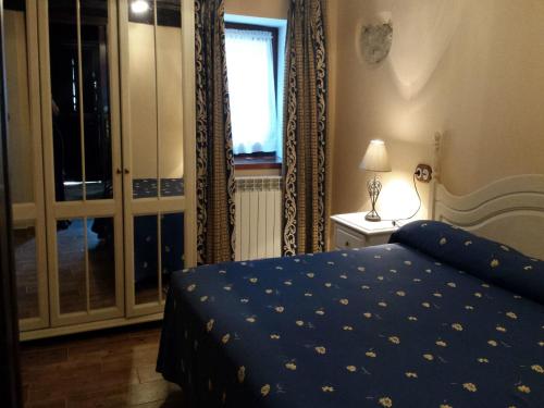 a bedroom with a bed and a sliding glass door at El Requexu, apartamentos a 900 m de la playa de Poo AR-0474-AS in Llanes