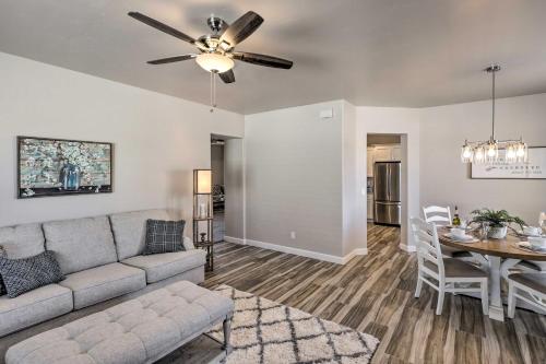 a living room with a couch and a table at Idyllic Kingman Retreat with Yard - Near Hiking in Kingman